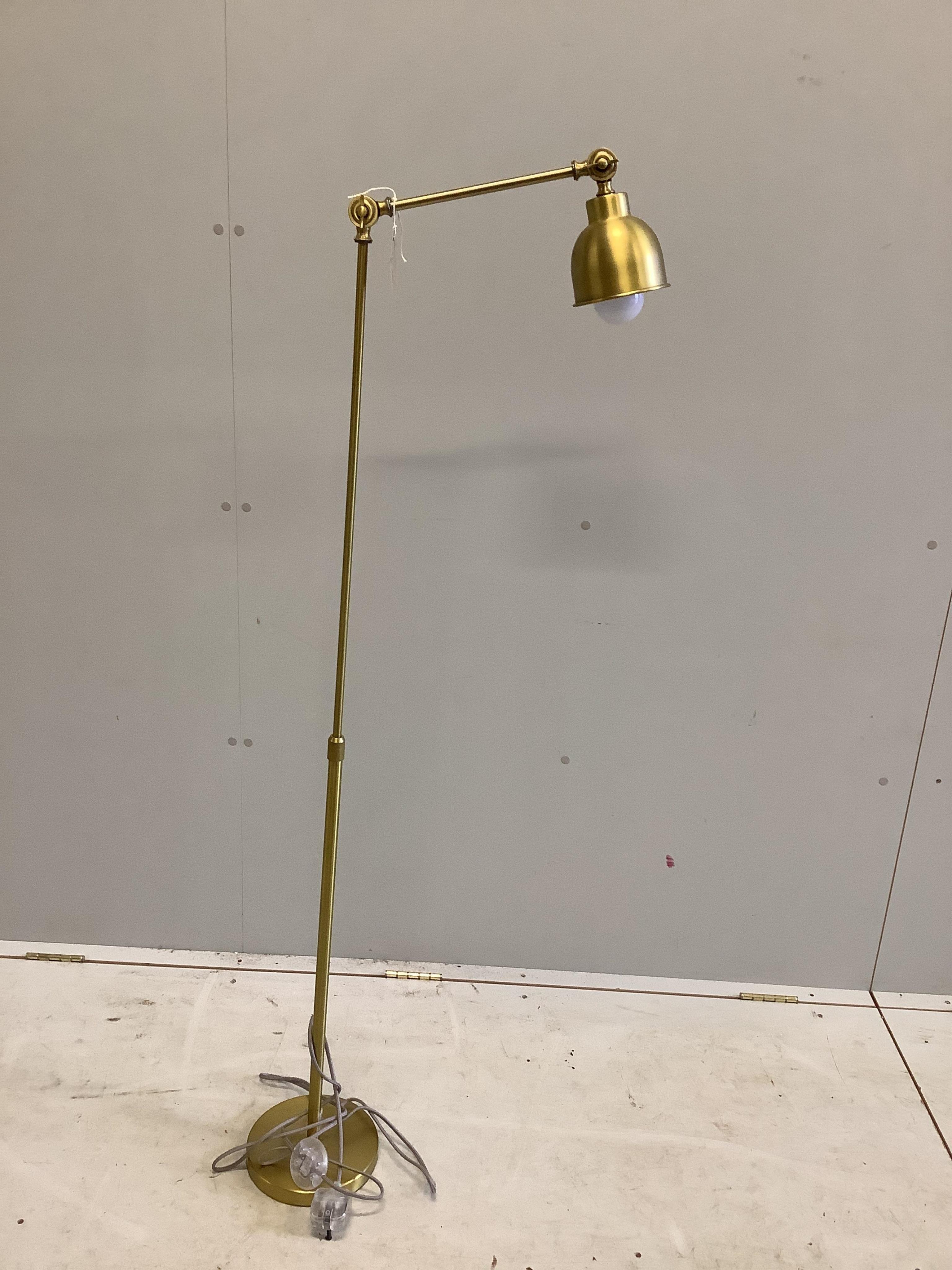 A Contemporary gilt metal adjustable floor lamp, height 143cm. Condition - good